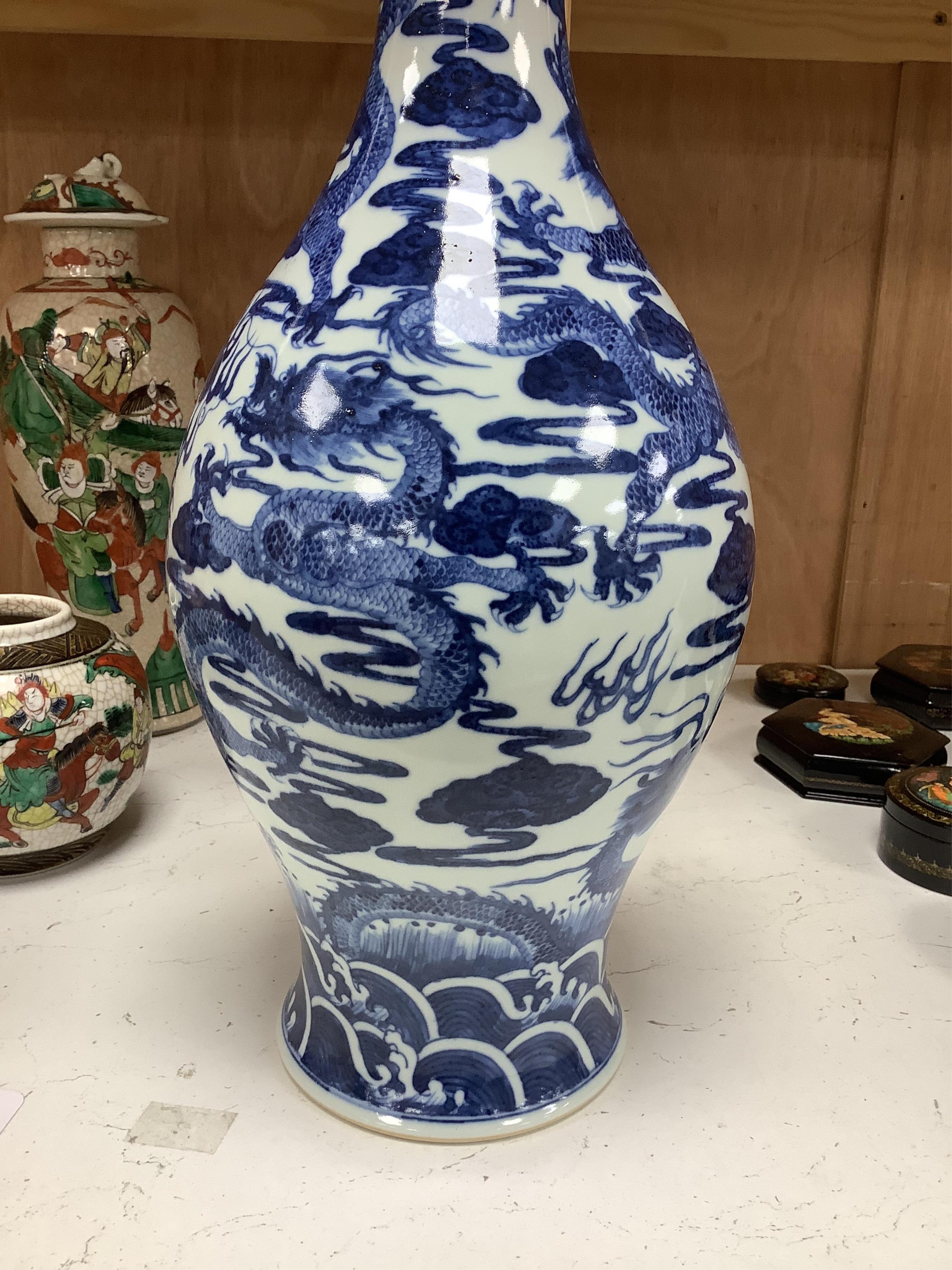 A large Chinese blue and white dragon vase, 40 cm high.